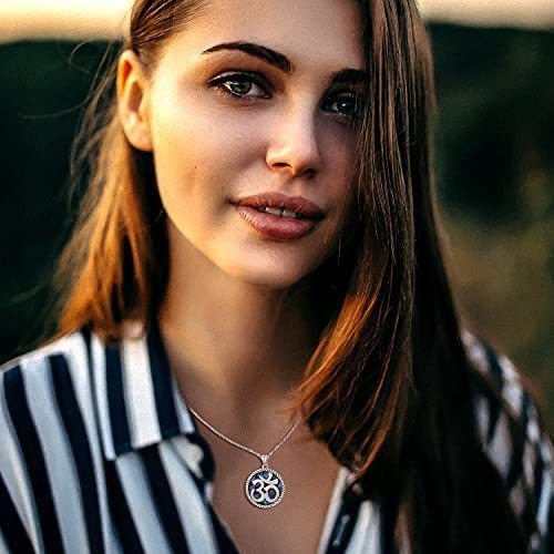 om symbol necklace in the woman's neck